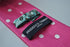 pink tie with white polka dots