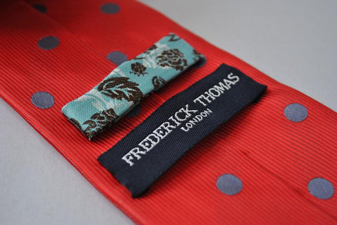 red tie with grey polka spots