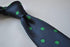 navy blue tie with green polka dots