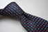 navy tie with red and light blue pin spots