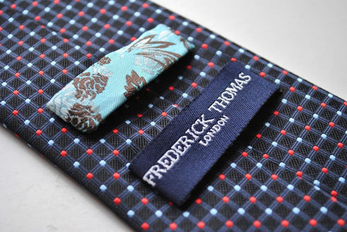 navy tie with red and light blue pin spots