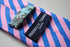 pink and blue striped tie