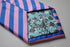 pink and blue striped tie
