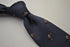 navy tie with horse racing pattern