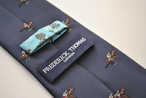 navy tie with horse racing pattern