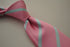pink and light blue striped tie