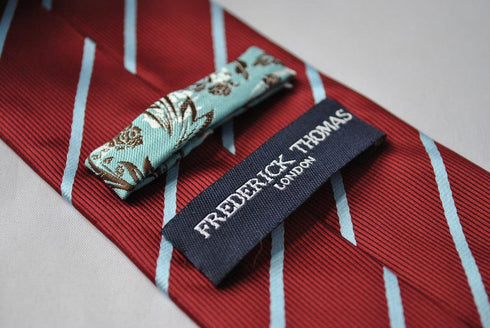maroon and thin blue striped tie