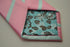 pink and light blue striped tie