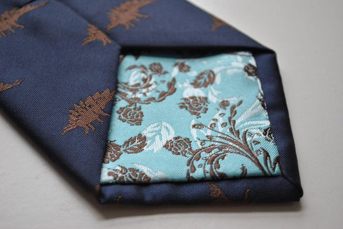 navy blue tie with stegosaurus dinosaur design