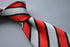 red, black and white striped tie
