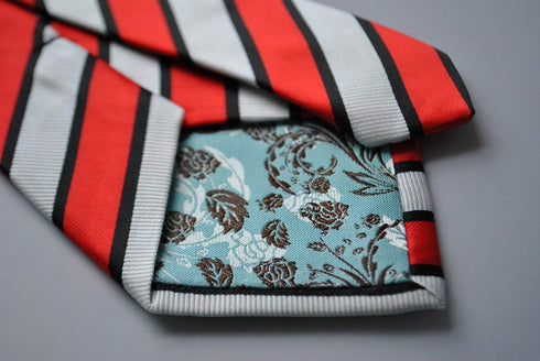 red, black and white striped tie
