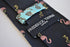 navy tie with flamingo embroidered design
