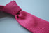 plain bright pink skinny knitted tie with pointed end
