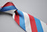 red, blue and white striped tie