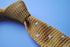 yellow gold skinny knitted tie with white polka dots