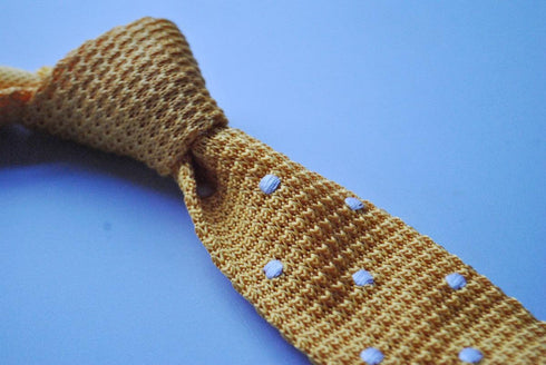 yellow gold skinny knitted tie with white polka dots