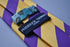 purple and yellow barber striped tie