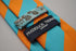 turquoise and orange barber striped tie