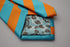 turquoise and orange barber striped tie