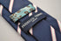 navy blue tie with white and pink stripes