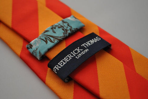 orange and red barber striped tie