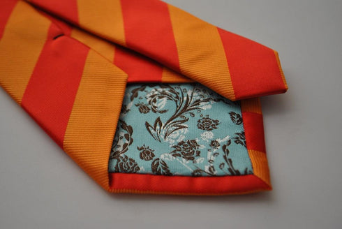 orange and red barber striped tie