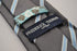 grey tie with light blue stripe