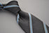 grey tie with light blue stripe