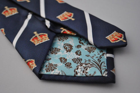 navy blue tie with crown design and white stripes
