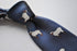 navy tie with sheep embroidered design