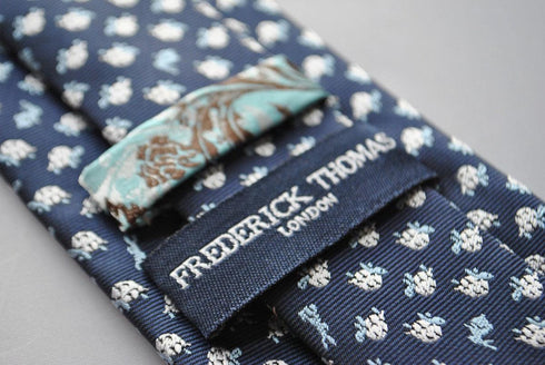 navy tie with hare and tortoise embroidered design