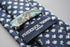 navy tie with hare and tortoise embroidered design
