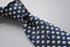 navy tie with hare and tortoise embroidered design