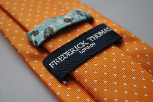 orange and white pin spot tie