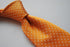 orange and white pin spot tie