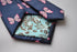 navy tie with pink butterfly embroidered design