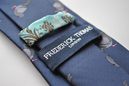 navy tie with grey pigeon embroidered design
