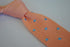 pale pink skinny knitted tie with light blue polka dots