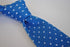 bright royal blue skinny knitted tie with white polka dots