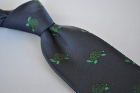 navy tie with green turtle design