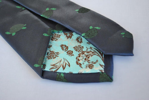 navy tie with green turtle design