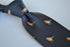 navy tie with embroidered robin design