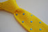 yellow skinny knitted tie with light blue polka dots