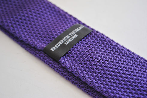 skinny knitted cadbury purple tie with light blue polka dots