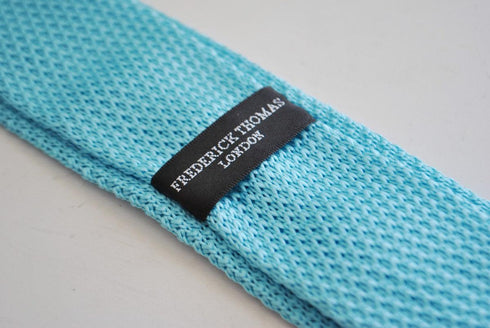 turquoise blue skinny knitted tie with white polka dots