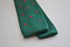 dark green skinny knitted tie with red polka dots