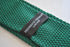 emerald green skinny knitted tie with white polka dots