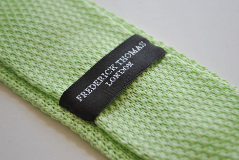 lime green skinny knitted tie with white polka dots