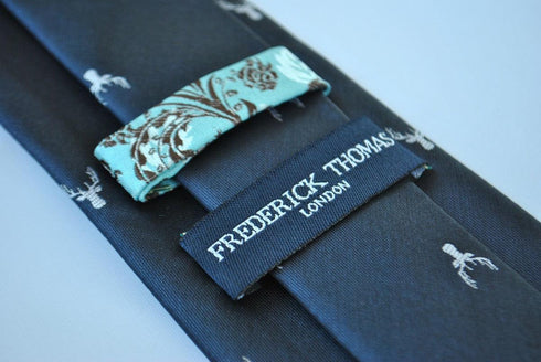 navy blue tie with white deer head design
