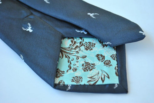 navy blue tie with white deer head design